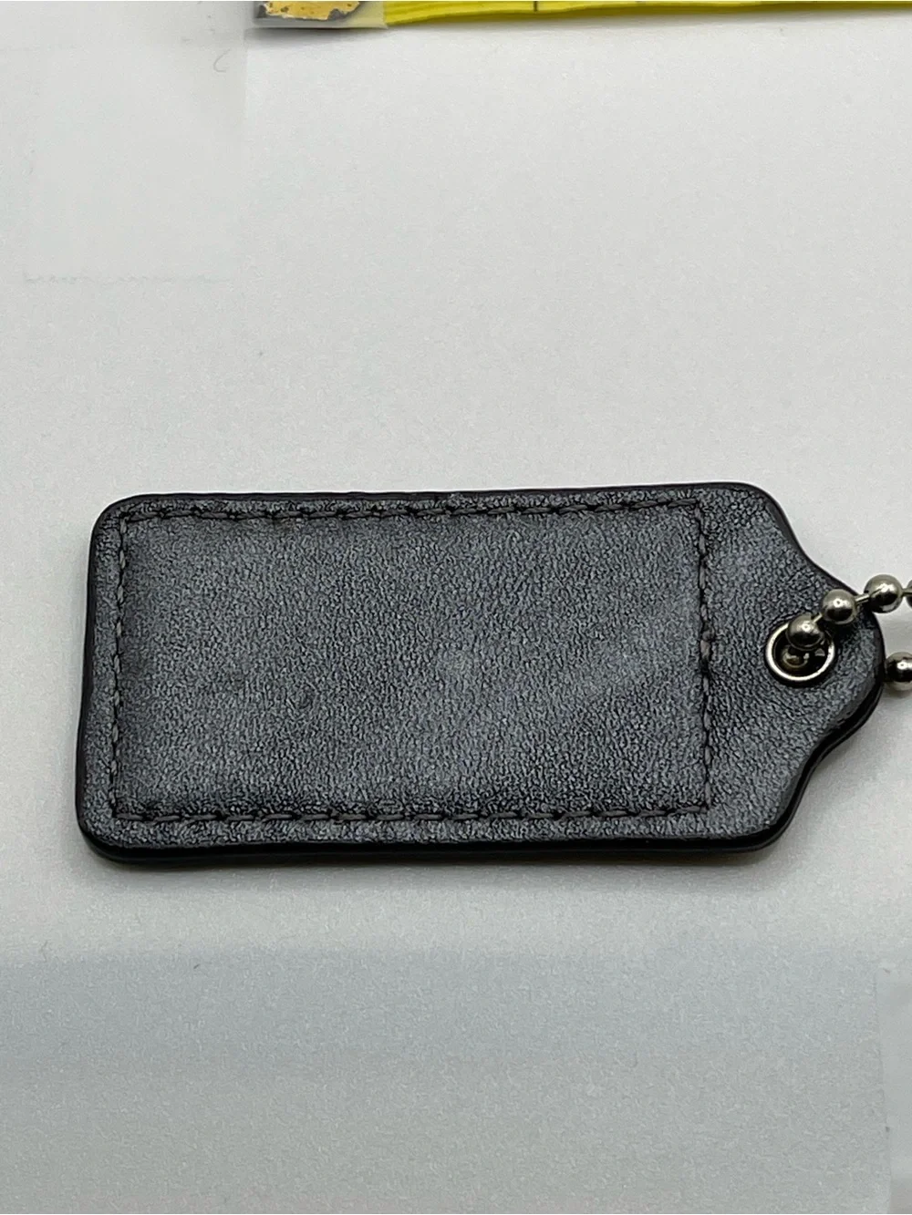 COACH Patent Leather Hang Tag Brown and Iridescent Gray